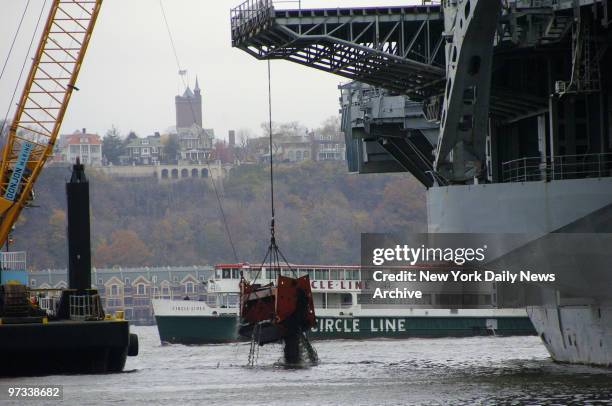 Dredging begins near the Intrepid Sea-Air-Space Museum in an effort to free the aircraft carrier from mud and silt that forced a delay in its trip to...