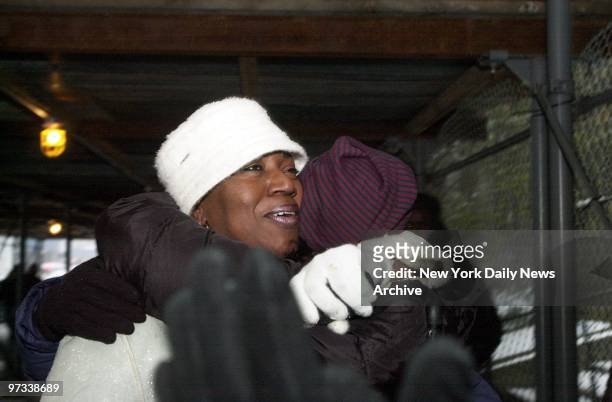 Pat Butler, a friend of the family of one of the defendants in the Central Park jogger case, is embraced at a rally in support of the five men. The...