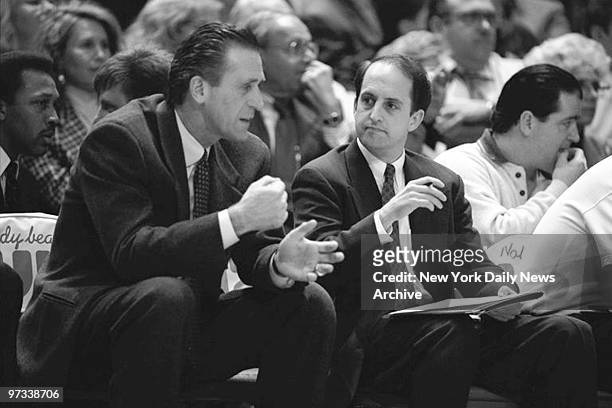 Pat Riley , head coach of the New York Knicks, and Jeff Van Gundy speak during a game against the Portland Trail Blazers.