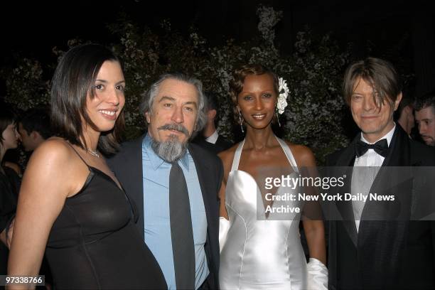Drena De Niro and dad Robert join supermodel Iman and husband, singer David Bowie, at the Metropolitan Museum of Art for the preview of Goddess, an...
