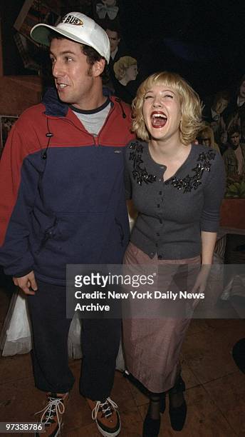 Drew Barrymore and actor Adam Sandler promoting their movie "The Wedding Singer" at Planet Hollywood.