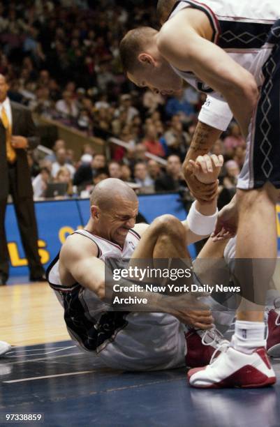 With 6:59 left in the game, New Jersey Nets' Jason Kidd falls and twists his right ankle on a rebound during Game 4 of Eastern Conference finals...