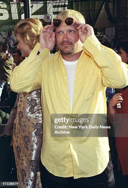 Drew Carey raises the shades for a better view at premiere of the movie "Godzilla" at Madison Square Garden.