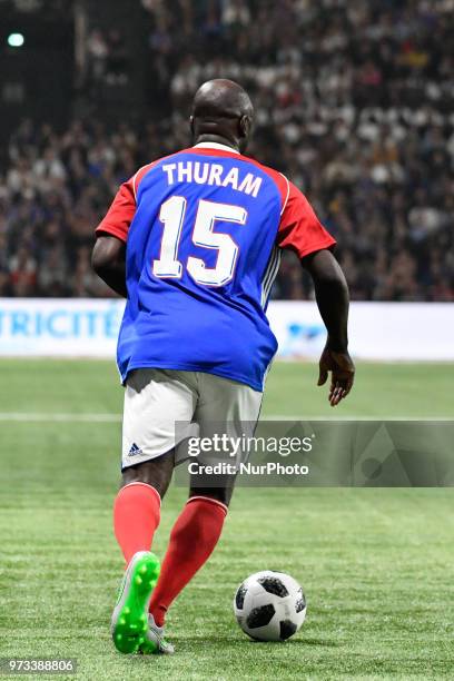 Lilian Thuram during an exhibition football match between France's 1998 World Cup's French football national team and FIFA 98 composed with former...