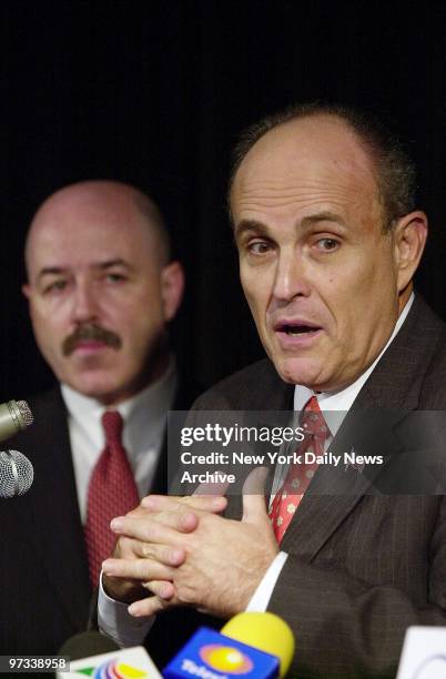 With former Police Commissioner Bernard Kerik looking on, former Mayor Rudy Giuliani says he will take a team and its crime-fighting techniques,...