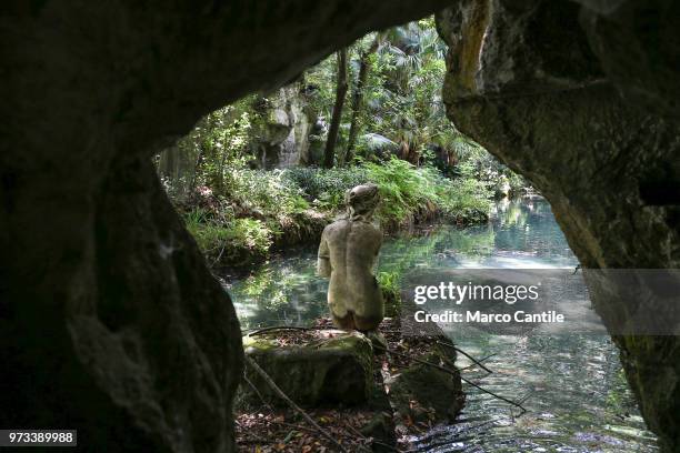 Rear view of the statue of Venus in the pond of english garden, inside the park of the Royal Palace of Caserta.