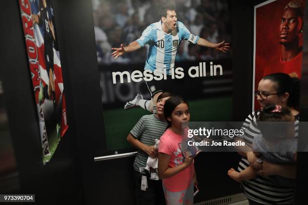 Telvia Prego along with her daughter Ava Prego and son David Prego ride in an elevator while shopping at the Soccer Locker store as they prepare to...