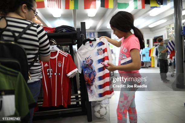 Telvia Prego and daughter Ava Prego shop at the Soccer Locker store as they prepare to show their support for their favorite World Cup soccer team...