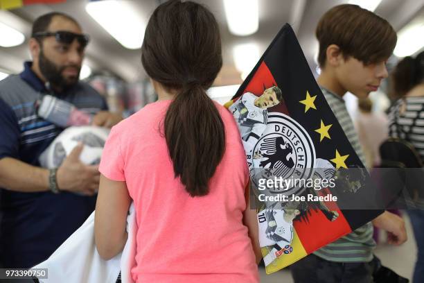 Ava Prego shops at the Soccer Locker store for German soccer team items as she prepares to show her support for her favorite World Cup soccer team...