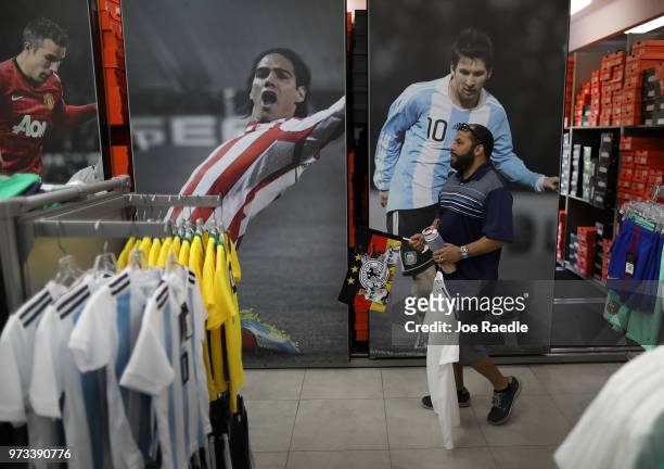 Rodrigo Prego shops at the Soccer Locker store for German soccer team items as he prepares to show his support for his favorite World Cup soccer team...