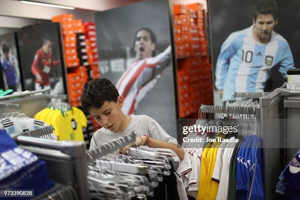 Matthias Meyer shops at the Soccer Locker store for German soccer team items as he prepares to show his support for his favorite World Cup soccer...