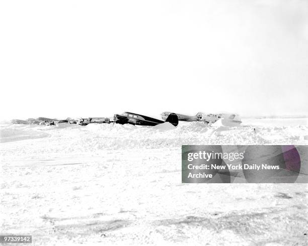 With no more room in the hangers, planes that had to wait outside at LaGuardia Airport were as badly snowed in as surface transportation vehicles.