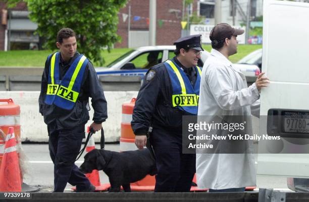 With security heightened for Fleet Week and the Memorial Day Weekend, police with a bomb-sniffing dog check a truck at the Brooklyn entrance to the...