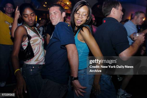 Patrons party at the recently-reopened Razzoo Club and Patio, which features live bands, on Bourbon St. In the famed French Quarter of New Orleans,...