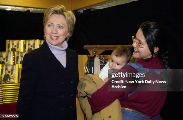 Woman brings her baby to meet Senator-elect Hillary Rodham Clinton at Barnes & Noble on Fifth Ave., where the First Lady was promoting her book, "An...