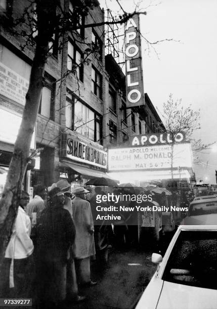 Patrons wait outside the Apollo Theater on 125th St., for opening performance.
