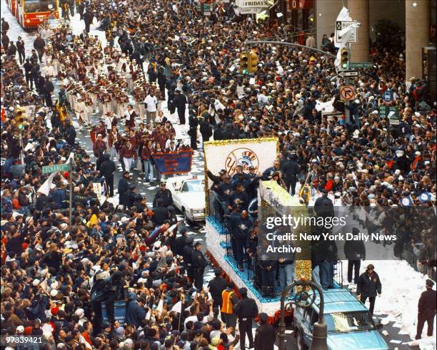 World Champion New York Yankees make their way up Broadway during World Series victory parade.