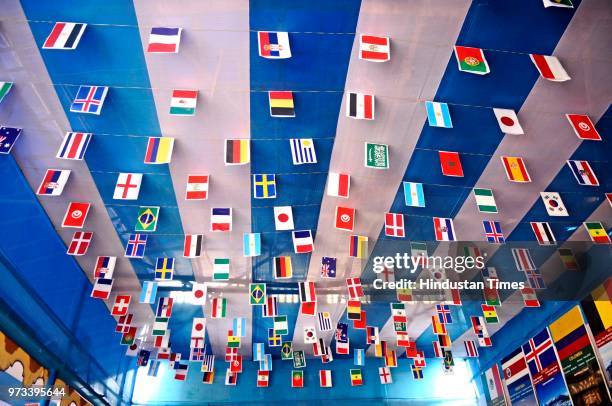 Argentina football fans club decorate their club premises with flags of 32 countries, cut-outs, and some icon footballers clay idol to celebrate...