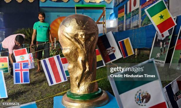 Argentina football fans club decorate their club premises with flags of 32 countries, cut-outs, and some icon footballers clay idol to celebrate...