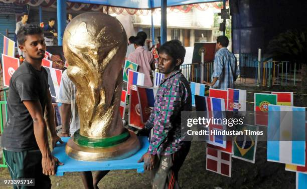 Argentina football fans club decorate their club premises with flags of 32 countries, cut-outs, and some icon footballers clay idol to celebrate...