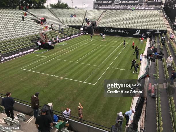 Roger Federer of Switzerlands unpacks his new racket during day 3 of the Mercedes Cup at Tennisclub Weissenhof on June 13, 2018 in Stuttgart,...