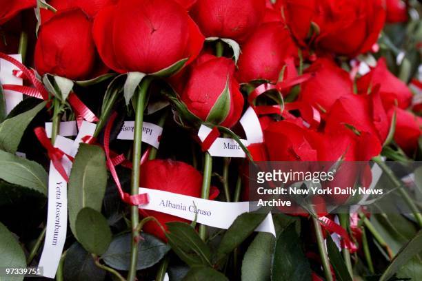 Workers who perished in the infamous Triangle Shirtwaist Company fire are remembered with red roses during a memorial service held by the Hebrew...