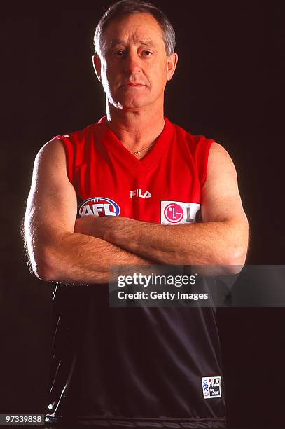 Former AFL/VFL player and coach Stan Alves poses in a Melbourne Demons AFL guernsey during a portrait session on August 21, 2000 in Melbourne,...