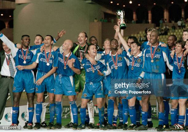 The Chelsea team celebrate with the trophy after the UEFA Super Cup Final between Real Madrid and Chelsea at the Stade Louis II on August 28, 1998 in...