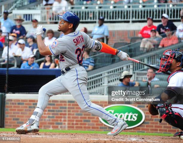 Dominic Smith of the New York Mets follows through during a fifth inning at-bat against the Atlanta Braves at SunTrust Field on June 13, 2018 in...