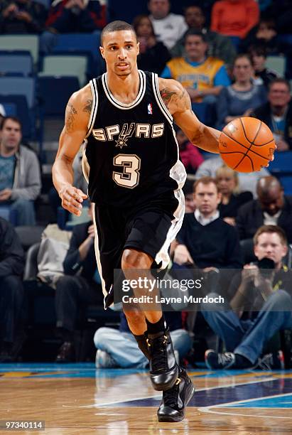 George Hill of the San Antonio Spurs drives against the New Orleans Hornets on March 1, 2010 at the New Orleans Arena in New Orleans, Louisiana. NOTE...