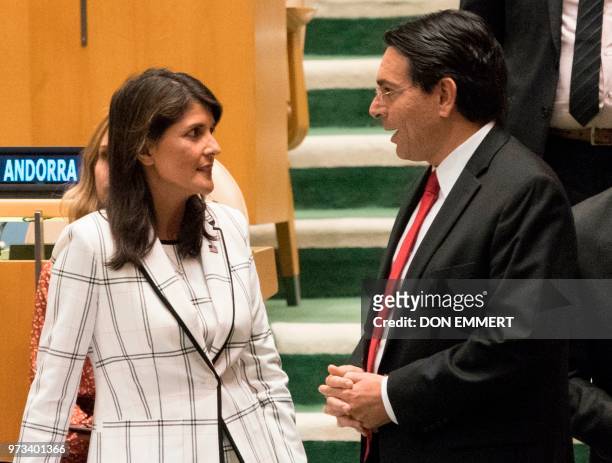 Ambassador to the United Nations Nikki Haley talks with Israel's Ambassador to the UN Danny Danon before a vote, to deplore Israeli actions in...