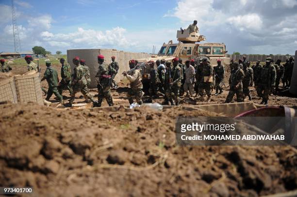 Somali soldiers enter Sanguuni military base, where an American special operations soldier was killed by a mortar attack on June 8, about 450 km...