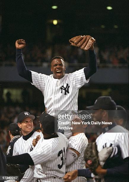 Yankees' pitcher Dwight Gooden is carried from the field by his teammates after pitching his first no-hitter in game against the Seattle Mariners at...