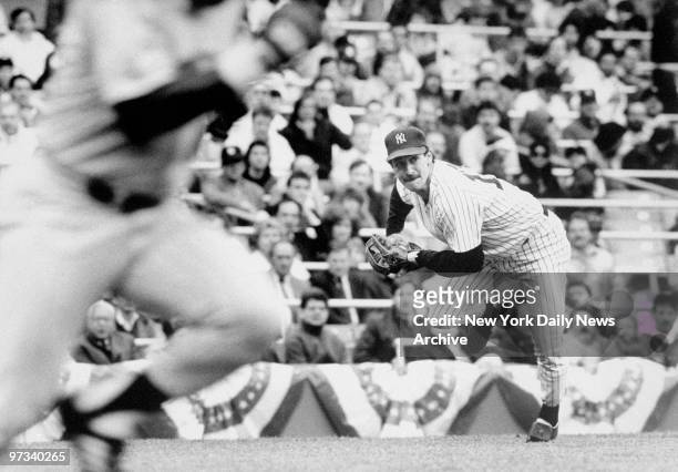 Yankees third baseman Mike Pagliarulo charges to field Al Newman's slow roller and throw out the Minnesota second baseman in the fifth inning.