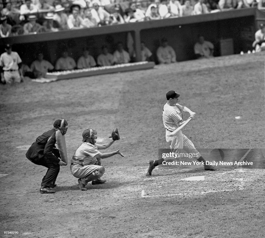 Yanks vs. Philadelphia: Joe DiMaggio hits a pitch.