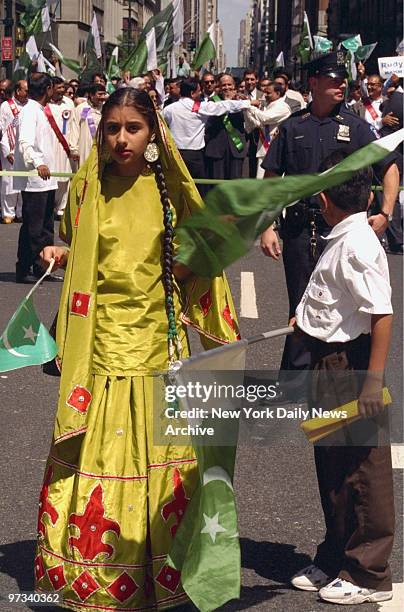 Young girl wearing a traditional dress marches down Madison Ave. During the Pakistan Day Parade.