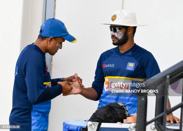 Roshen Silva of Sri Lanka gets ready to take part in a training session one day ahead of the 2nd Test between West Indies and Sri Lanka at Daren...