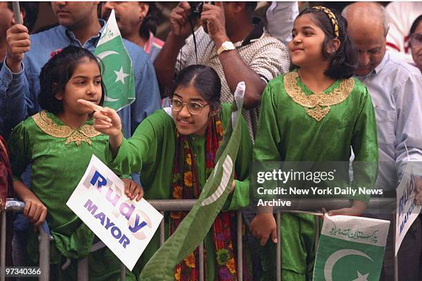 Young girls spot Mayor Rudy Giuliani along the parade route during the annual Pakistan Day Parade.