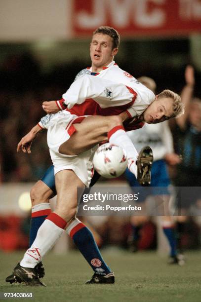 Dennis Bergkamp of Arsenal tangles with Steve Vickers of Middlesbrough during an FA Carling Premiership match at Highbury on January 1, 1997 in...