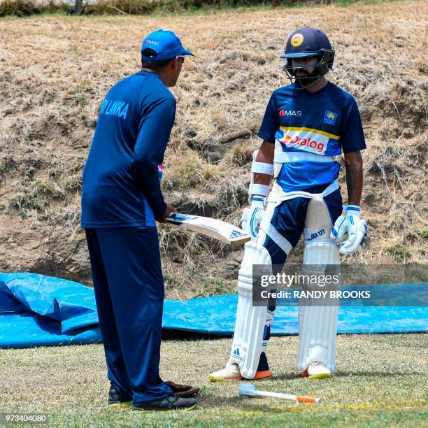 Niroshan Dickwella of Sri Lanka takes part in a training session one day ahead of the 2nd Test between West Indies and Sri Lanka at Daren Sammy...