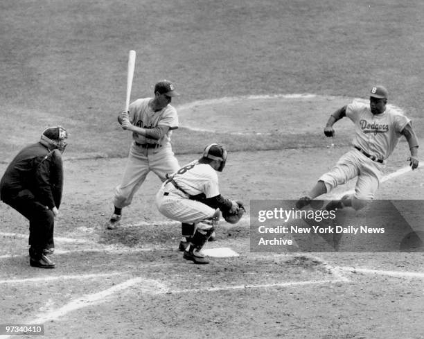 Yogi has it Out. Jackie Robinson, with two out in the eighth inning and the Dodgers trailing, 6-4, in the Series opener at the Stadium, tried to...