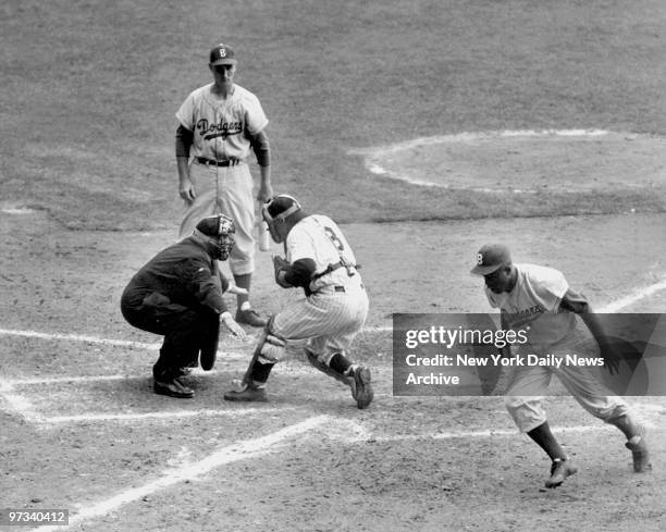 Yogi has it Out. Jackie Robinson, with two out in the eighth inning and the Dodgers trailing, 6-4, in the Series opener at the Stadium, tried to...