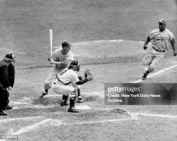 Yogi has it Out. Jackie Robinson, with two out in the eighth inning and the Dodgers trailing, 6-4, in the Series opener at the Stadium, tried to...