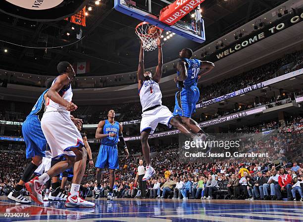 Samuel Dalembert of the Philadelphia 76ers dunks against the Orlando Magic during the game on March 1, 2010 at the Wachovia Center in Philadelphia,...
