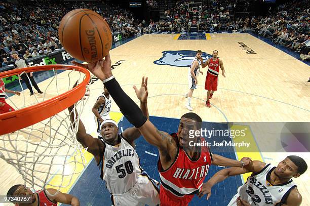 LaMarcus Aldridge of the Portland Trail Blazers shoots over Zach Randolph and Rudy Gay of the Memphis Grizzlies on March 1, 2009 at FedExForum in...
