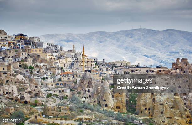goreme town with mosque and residences in rock formations, cappadocia region, turkey - capadócia imagens e fotografias de stock