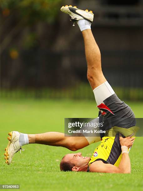 Tadhg Kennelly stretches during a Sydney Swans AFL training session at Lakeside Oval on March 2, 2010 in Sydney, Australia.