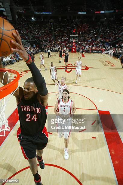 Sonny Weems of the Toronto Raptors shoots the ball over Luis Scola of the Houston Rockets on March 1, 2010 at the Toyota Center in Houston, Texas....