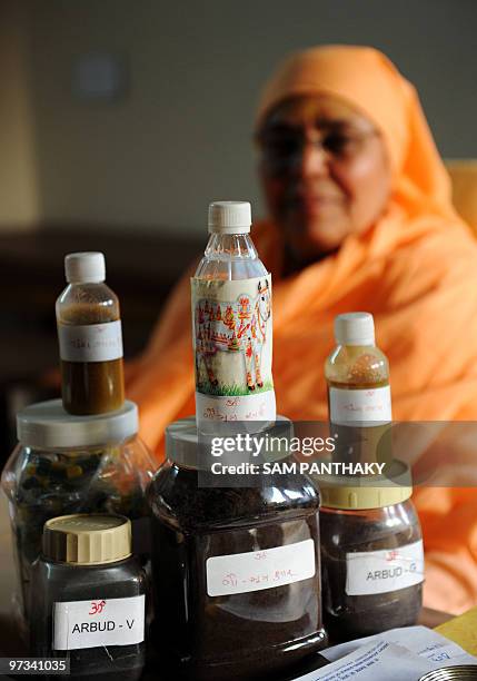 India-science-medicine-research-cows,FEATURE by Rupam Jain Nair This photo taken on February 27, 2010 shows Shree Maa Anantanand sitting behind...