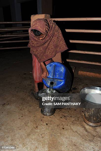 India-science-medicine-research-cows,FEATURE by Rupam Jain Nair This photo taken on February 27, 2010 shows a farm worker pouring cow urine into a...